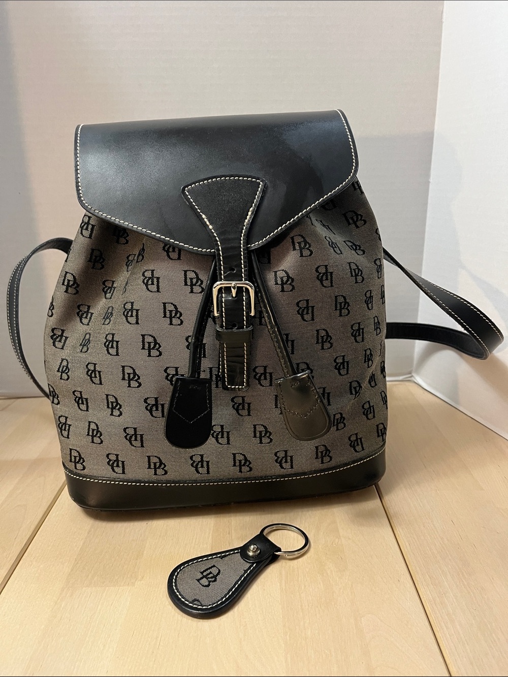 Vintage Dooney & Bourke DB
Black Signature Canvas & Leather Backpack + Keychain